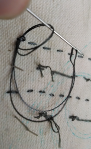 Threads make an inchoate knot, ready to be drawn taut.